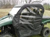 Side view of the 3 Star enclosure soft door with clear window, top and windshield on the green Yamaha Viking