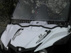 3 Star one-piece windshield on a white Yamaha Wolverine, angled close-up showing the vent slots and edge seal