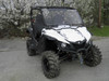 Front three-quarter view of the whole white Yamaha Wolverine with the 3 Star windshield and mud tires