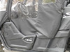 Close-up of the 3 Star driver side soft door on a Yamaha Wolverine swung open, showing the steering wheel and seat