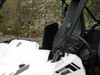Close-up of the 3 Star soft top front edge where it meets the cage of a white Yamaha Wolverine