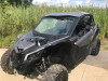 Extreme Metal Products black aluminum roof installed on a gray Can-Am Maverick X3, front three-quarter view