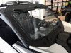 Extreme Metal Products laminated glass windshield with wiper and slide vent on a white Can-Am Maverick X3 in a showroom