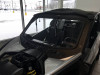 Side view of the Extreme Metal Products glass windshield frame and wiper on the white Can-Am Maverick X3