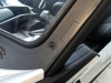 Close-up of the Extreme Metal Products windshield frame edge, rubber seal and mirror knockout along the cage pillar