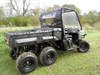 3 Star soft back panel and top installed on a green six-wheel Polaris Ranger, rear three-quarter view on grass