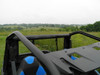 3 Star rear window on a Polaris General rolled up and strapped to the top cage tube, view from inside