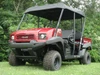 Front three-quarter view of a red four-seat side-by-side with the 3 Star soft top fitted
