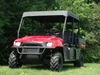 3 Star soft top on a red Polaris Ranger Crew, black canvas roof over the cage, front three-quarter view in a field