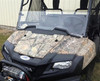 Extreme Metal Products clear Lexan half windshield installed on a camo Honda Pioneer 700, front view with winch