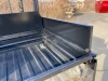 View into the Kubota RTV cargo bed showing the Extreme Metal Products side extension panel bolted along the bed rail