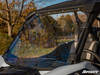SuperATV scratch resistant full windshield installed on a Kawasaki Teryx KRX 1000, close side view of the clear panel