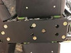 Close-up of bolts securing the Trail Armor skid plate to the frame of a Kawasaki Teryx KRX
