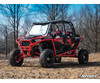 Front three-quarter view of a red four-seat Polaris RZR XP Turbo lifted with the SuperATV 3-inch lift kit
