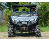 Front view of a silver Yamaha Viking lifted with the SuperATV 2-inch lift kit, mud tires and driver aboard