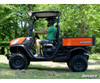 Side profile of a Kubota RTV X Series with the SuperATV 2 inch lift kit installed and a driver at the wheel