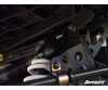Close-up of a SuperATV lift bracket bolted to the Ranger XP 1000 frame above the white coil spring and sway bar