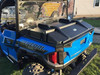 Extreme Metal Products black bed cover closed on a blue Polaris General XP 1000, rear three-quarter view