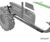SuperATV nerf bar under the doors of a white Kawasaki Teryx 4 with the vehicle grayed out around it