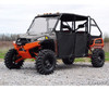 Front three-quarter view of a tan and orange Polaris Ranger XP1000 with SuperATV aluminum doors installed