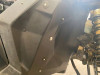 Close-up of the Extreme Metal Products firewall liner bolted into the Can-Am Maverick X3 front wheel well