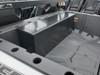 View over the tailgate of the Polaris General 1000 at the closed Hi-Standard security box below the rear seats