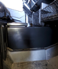 Passenger side view of the closed Hi-Standard center console beside the seat and cargo net in a Honda Pioneer 1000
