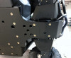 Trail Armor skid plate wrapping the rear suspension mount area under a Yamaha Wolverine X4, close-up from the side