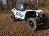 Front three-quarter view of a white and blue Arctic Cat Wildcat XX with the Side X Side upper doors installed