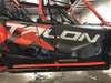 Trail Armor lower door inserts installed on a red and black Honda Talon 1000X-4, side view of both doors