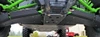 Wide low view under the front of the Kawasaki Teryx KRX showing both Trail Armor iMpact front guards and skid plate