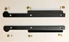 Pair of Trail Armor iMpact trailing arm guards for the Kawasaki Teryx KRX laid out with mounting bolts