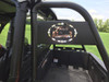 Close-up of the Trail Armor logo plate on the rear rack upright behind the Polaris General 1000 cab