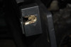 Close-up of the Trail Armor GenX door latch striker recessed in the black door frame