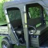 Tiny front three-quarter view of a Kawasaki Mule 3000/3010 Trans with the 3 Star full cab enclosure