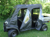Front three-quarter view of a Kawasaki Mule 3000/3010 Trans with the 3 Star cab enclosure doors zipped