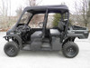 3 Star mini cab soft top and vinyl windshield on a black four-seat Kawasaki side-by-side, side view