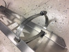Close-up of the stainless band clamp riveted to the underside of the Universal Parts exhaust guard