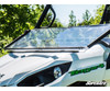 SuperATV scratch-resistant flip down windshield on a white Kawasaki Teryx, driver side front view