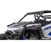 SuperATV flip down windshield folded forward over the hood of a white Polaris RZR PRO XP, front three-quarter view