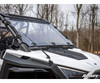 SuperATV flip down windshield in the closed position on a white Polaris RZR PRO XP, front three-quarter view in woods