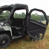 Seizmik full-hinged soft door swung open on a camo John Deere Gator XUV, side view in tall grass