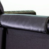 Padded black cover along the top of the framed door, close-up