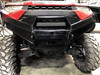 Pro Armor front bumper installed on a red Ranger XP1000, front view with the winch opening
