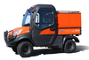 Wiedmann Bros Challenger 24-inch utility bed cap in orange on a Kubota X-Series with cab, side view