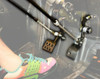 Close-up of Sure Grip hand control push rods linked to the gas and brake pedals in the footwell, foot in view