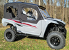 Front three-quarter view of the gray Yamaha Wolverine RMAX4 with the Side X Side full cab enclosure and doors