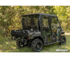 Rear three-quarter view of a camo Kawasaki Mule Pro in the woods with the SuperATV rear windshield installed