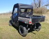 Rear three-quarter view of the 3 Star enclosure rear window and door on the camo Hisun Sector 550/750, bed visible