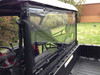 Extreme Metal Products hard rear window seen at an angle from the cargo bed, showing the upper clamp to the cab frame